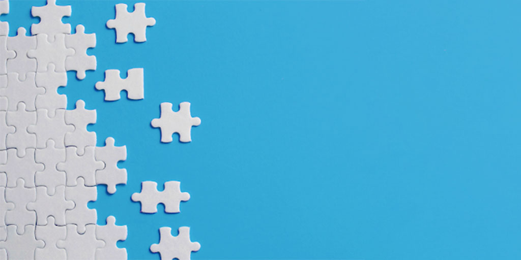 Image showing white jigsaw puzzle pieces on a blue background